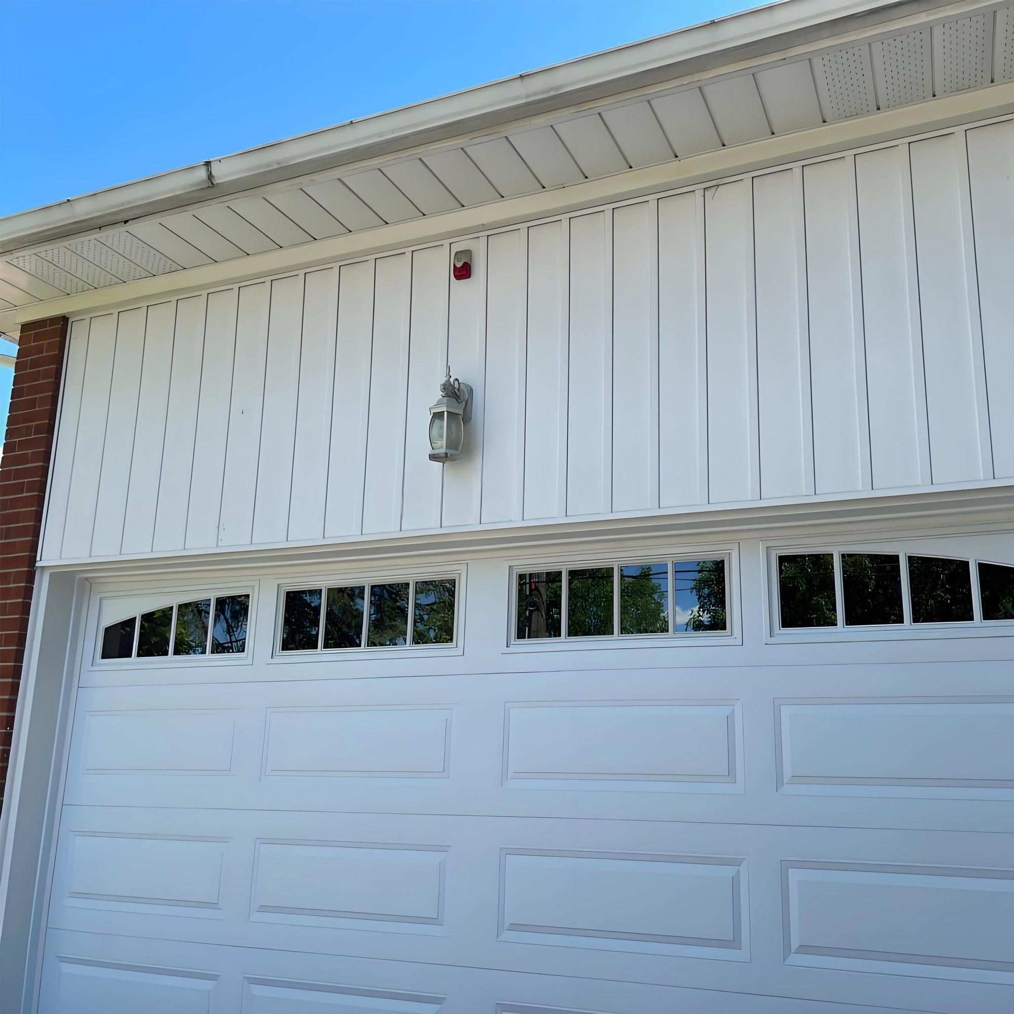 White villa garage door with glass